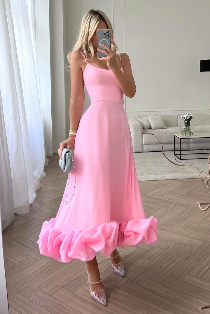 Stunning women's wedding guest dress, a ruffle hem maxi with a scoop neckline and flowing silhouette.