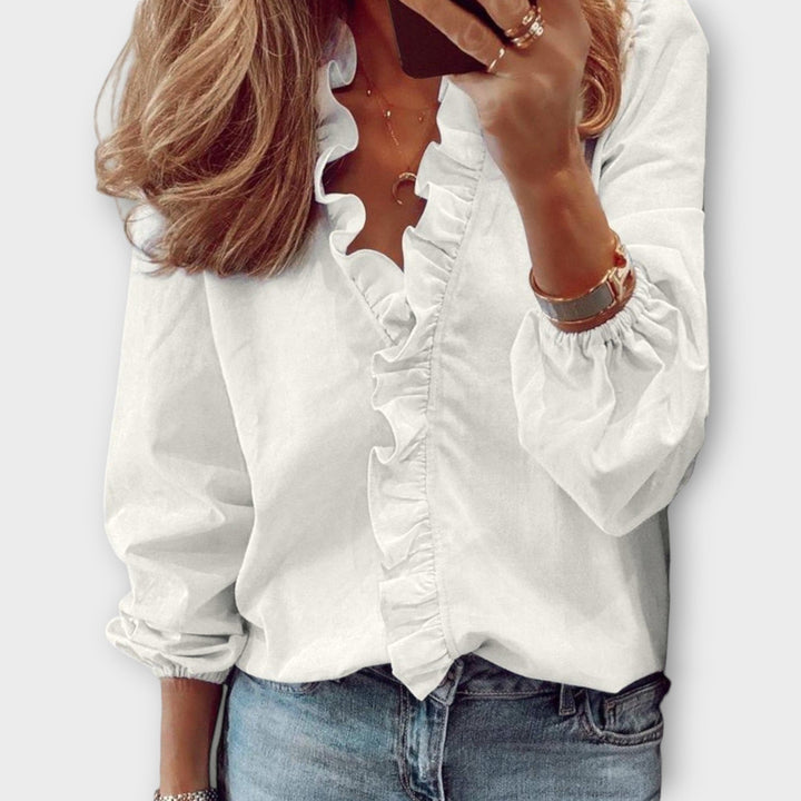 Elegant women's ruffled blouse, perfect for summer fashion, chic office wear or smart casual style.