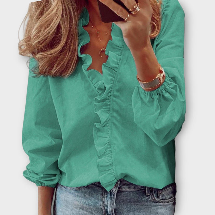 Modern women's elegant ruffled blouse, a stylish and comfortable top for summer fashion & versatile wear.
