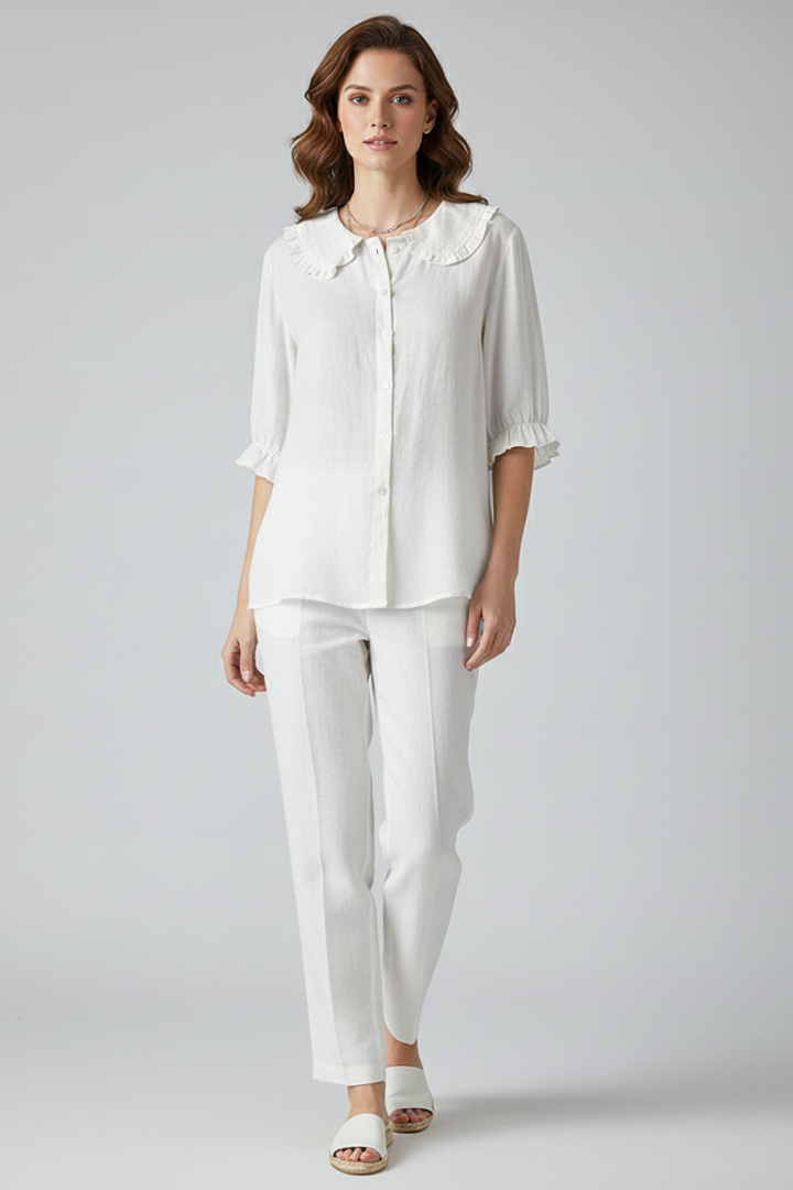 Stylish women's button-up shirt with a charming ruffled collar, perfect as a versatile elegant blouse for everyday wear.