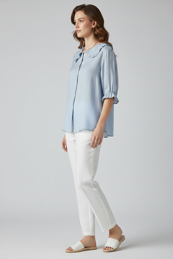 Full view of a women's mid-length sleeve button-up shirt with ruffled collar, an elegant & versatile top for work.