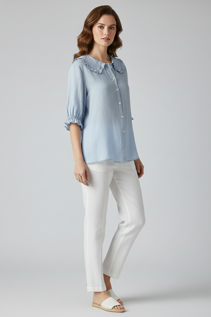 Women's versatile blouse featuring a classic button-up front and a beautiful ruffled collar, ideal for spring style.
