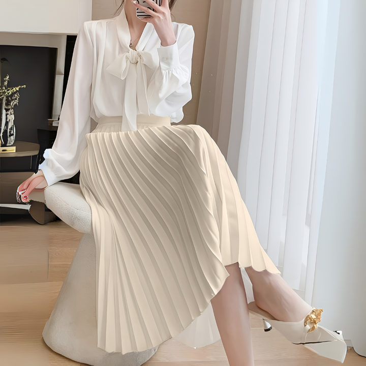 Women's versatile pleated midi skirt in elegant satin, great for casual chic or dressy looks.