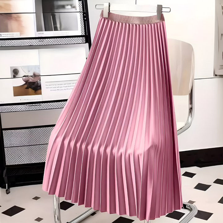 Close-up of luxurious high-waist pleated satin midi skirt, highlighting the elegant fabric and flowy pleats.