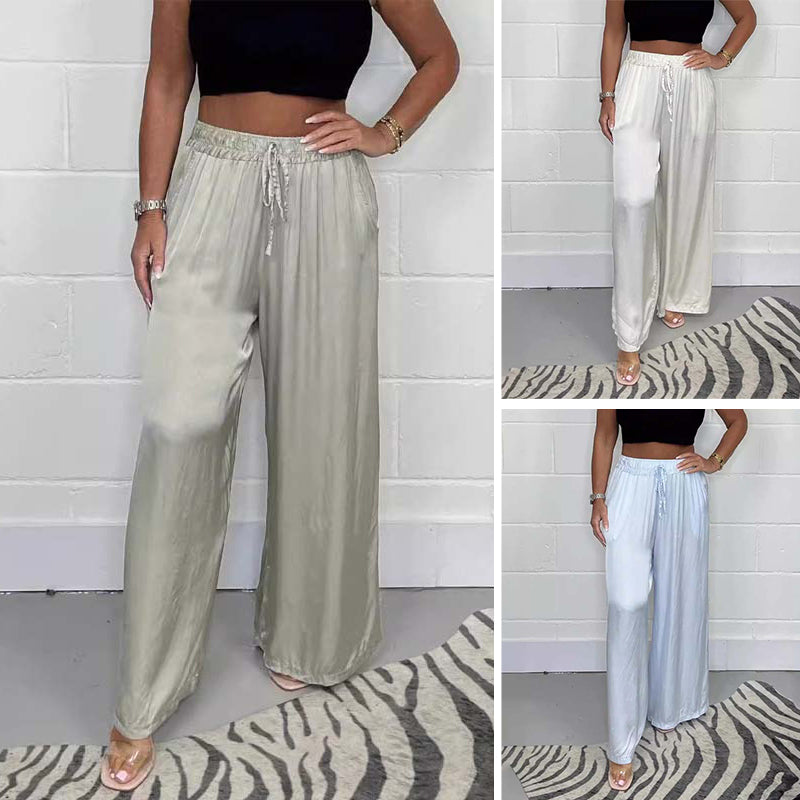 Elegant women's satin wide-leg trousers with lace-up detail, perfect for spring fashion