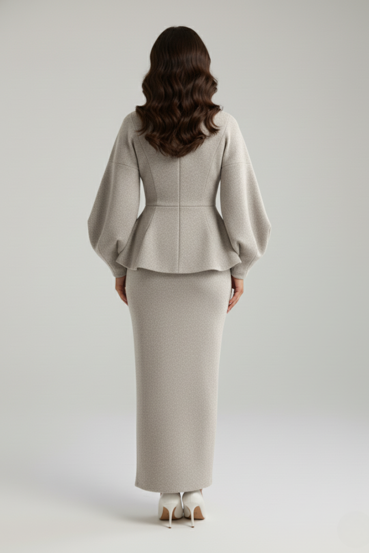 Tailored women's professional wear: a smart V-neck blazer with puff sleeves paired with a matching skirt suit.