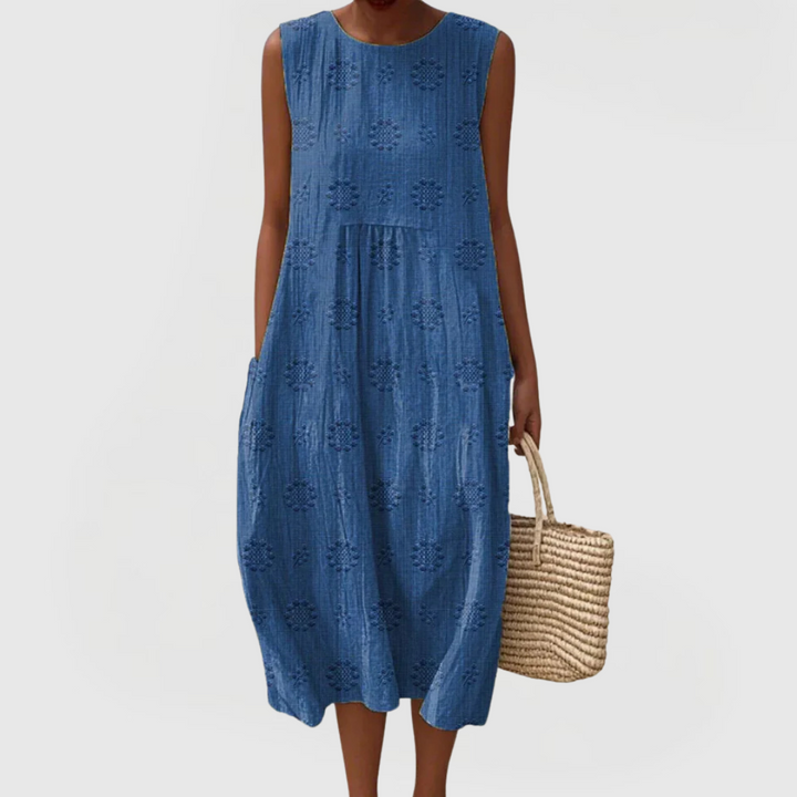 Embroidered women's sleeveless A-line dress, perfect for elegant summer casual or vacation outings.