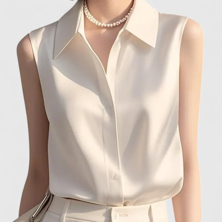 Sophisticated women's sleeveless top, ideal for professional attire. Elegant layering piece for any season.