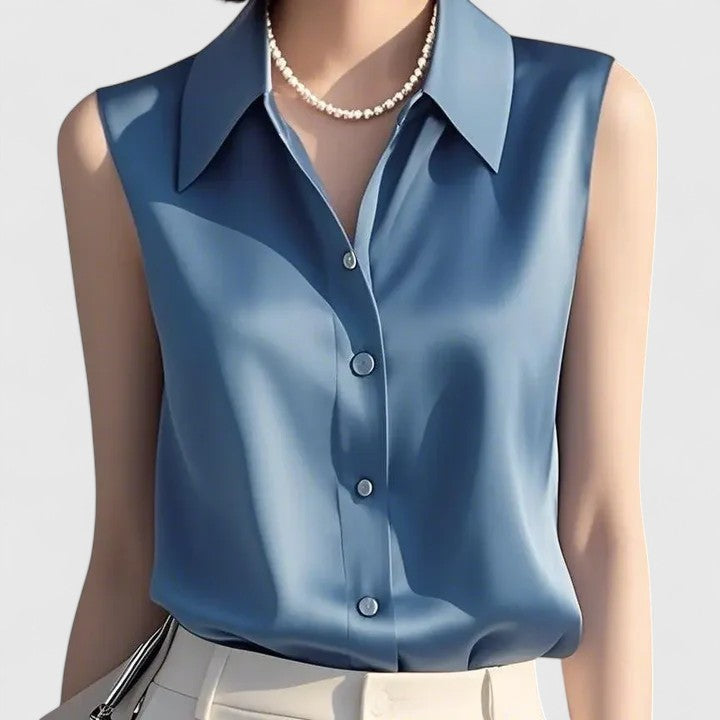 Chic women's sleeveless blouse. Dressy top suitable for office wear, professional settings, and elegant events.
