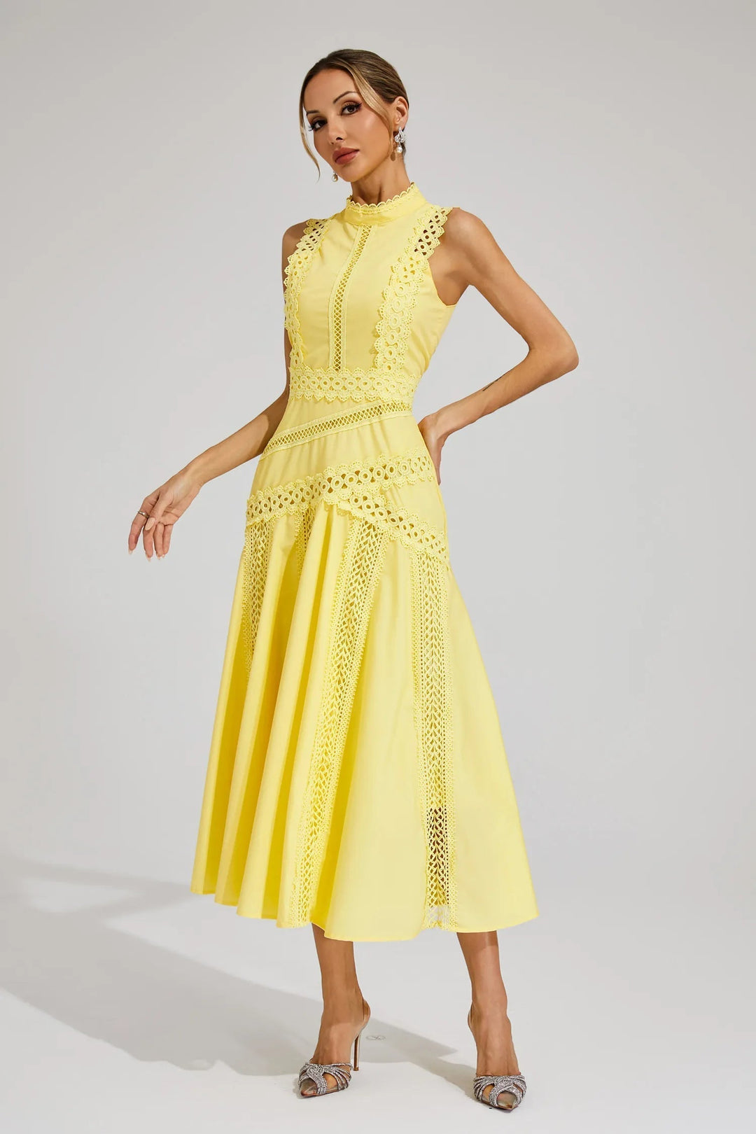 Fashionable women's elegant sleeveless midi dress with beautiful lace panels & a flattering flared skirt for summer.