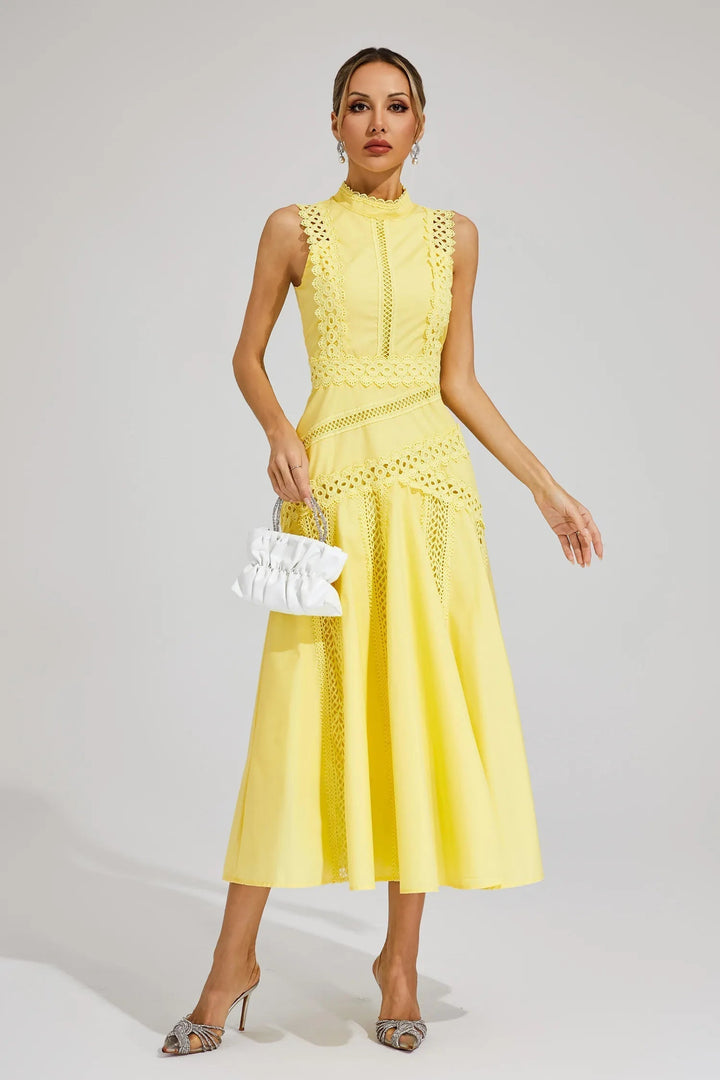 Sophisticated women's lace panel sleeveless midi dress. High neck, flared design perfect for summer events & parties.