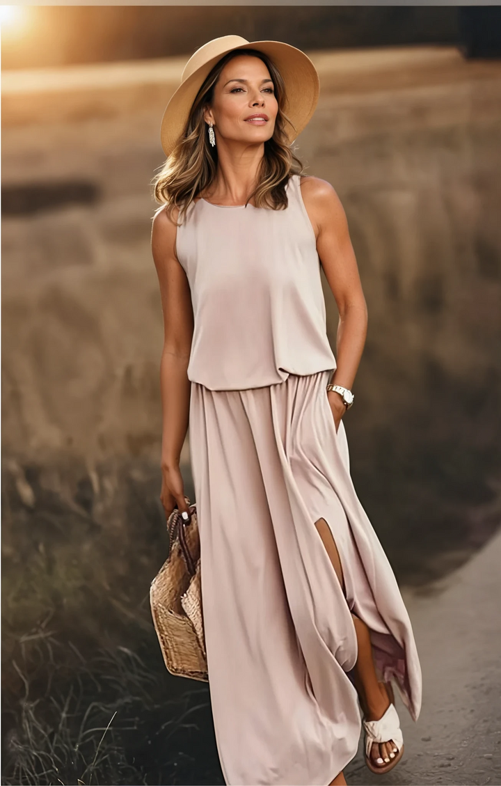 Stylish women's sleeveless maxi dress with pockets, round neck, long and flowy, perfect for summer elegance.