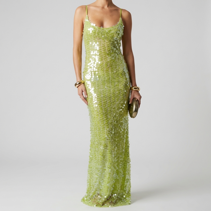 Elegant women's sleeveless sequin maxi dress. Eye-catching formal evening gown for glamorous special occasions.