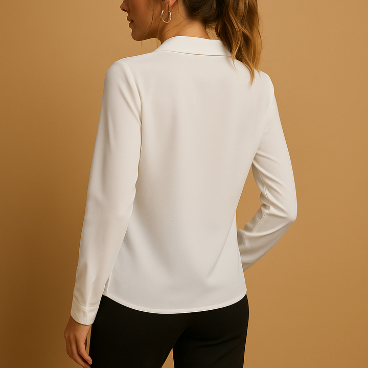 Modern women's solid long-sleeve blouse, tailored for a chic look. Adaptable elegant top for office to casual wear.