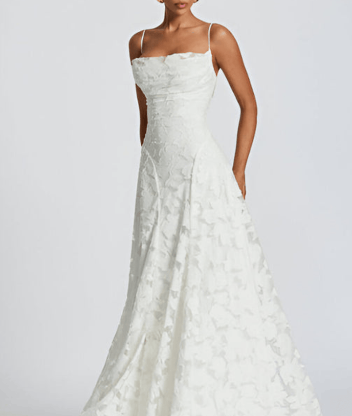 Chic white spaghetti strap A-line maxi dress with open back, great for summer or formal events.