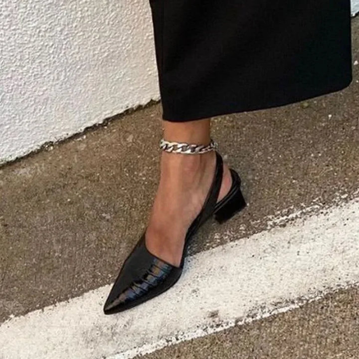 Stylish women's pumps with a sturdy block heel, ideal for adding a touch of elegance to any spring outfit.
