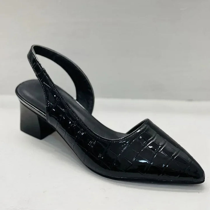 Pair of women's dress shoes: cream block heel pumps, combining comfort and spring fashion trends.