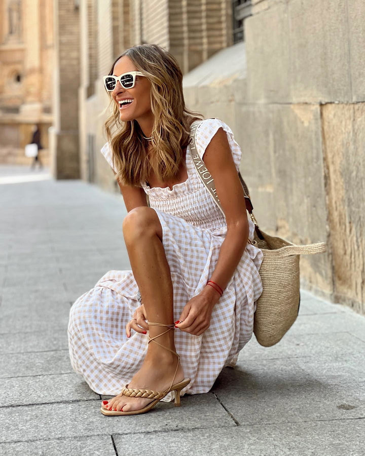 Comfortable women's maxi dress, solid color, featuring a flattering square neck & delicate ruffle sleeves.