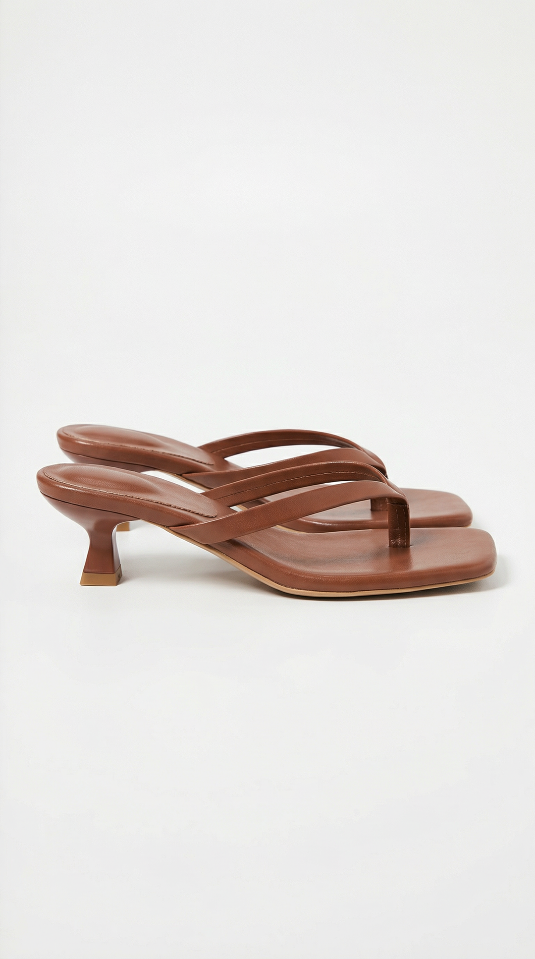 Stylish women's summer sandals with a square toe, thong detail, and practical kitten heel.