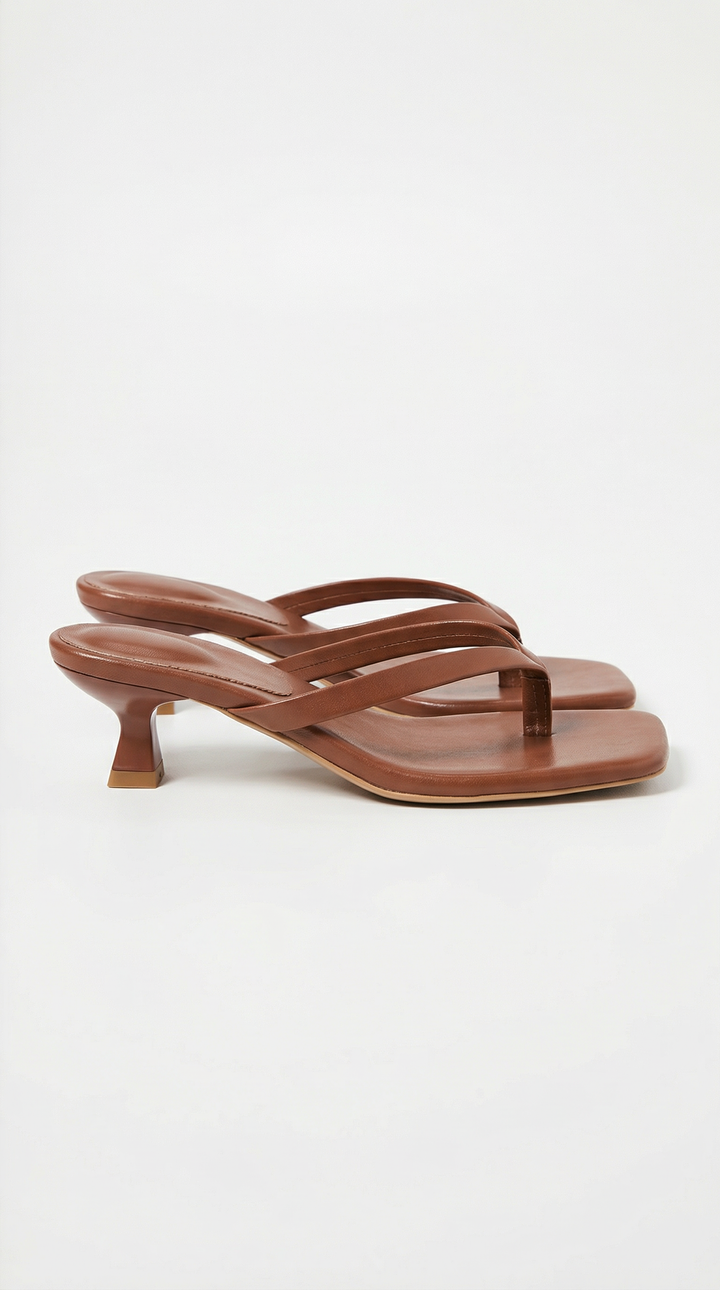 Stylish women's summer sandals with a square toe, thong detail, and practical kitten heel.