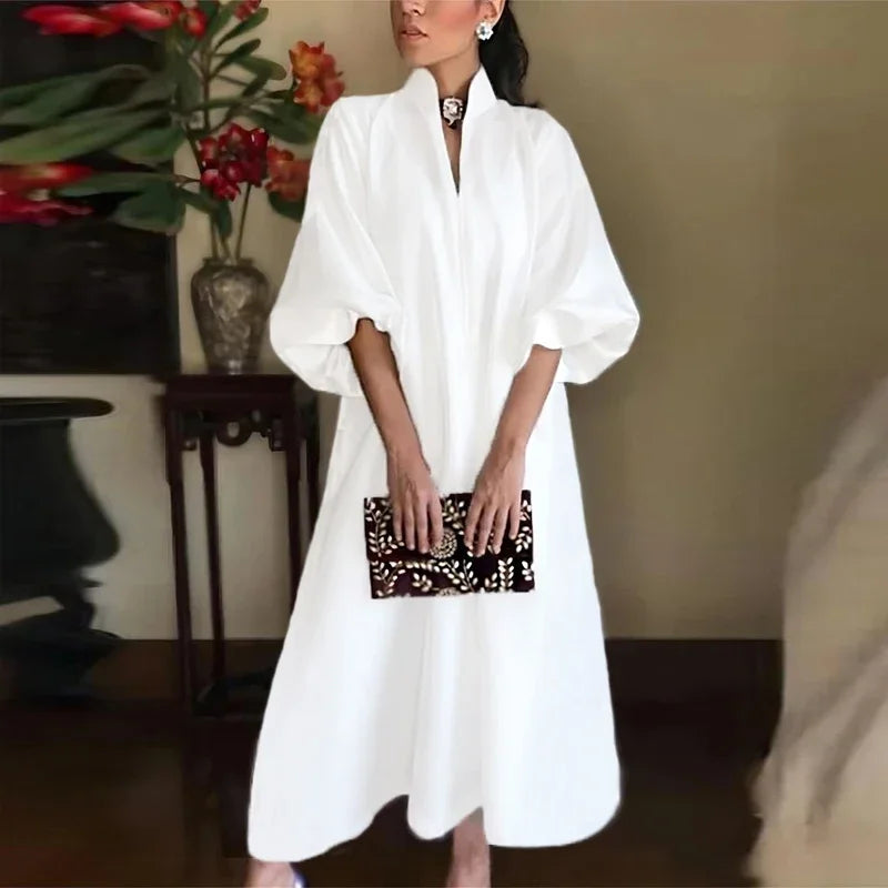Elegant women's stand collar puff sleeve A-line midi dress. Perfect for formal events, parties & special occasions.