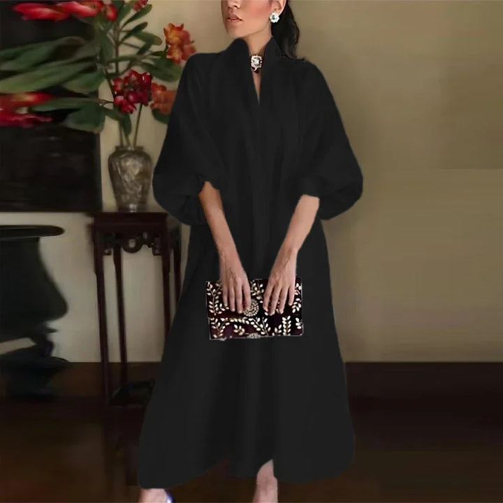 Chic women's puff sleeve midi dress with stand collar. Ideal as an evening gown, cocktail dress or party wear.