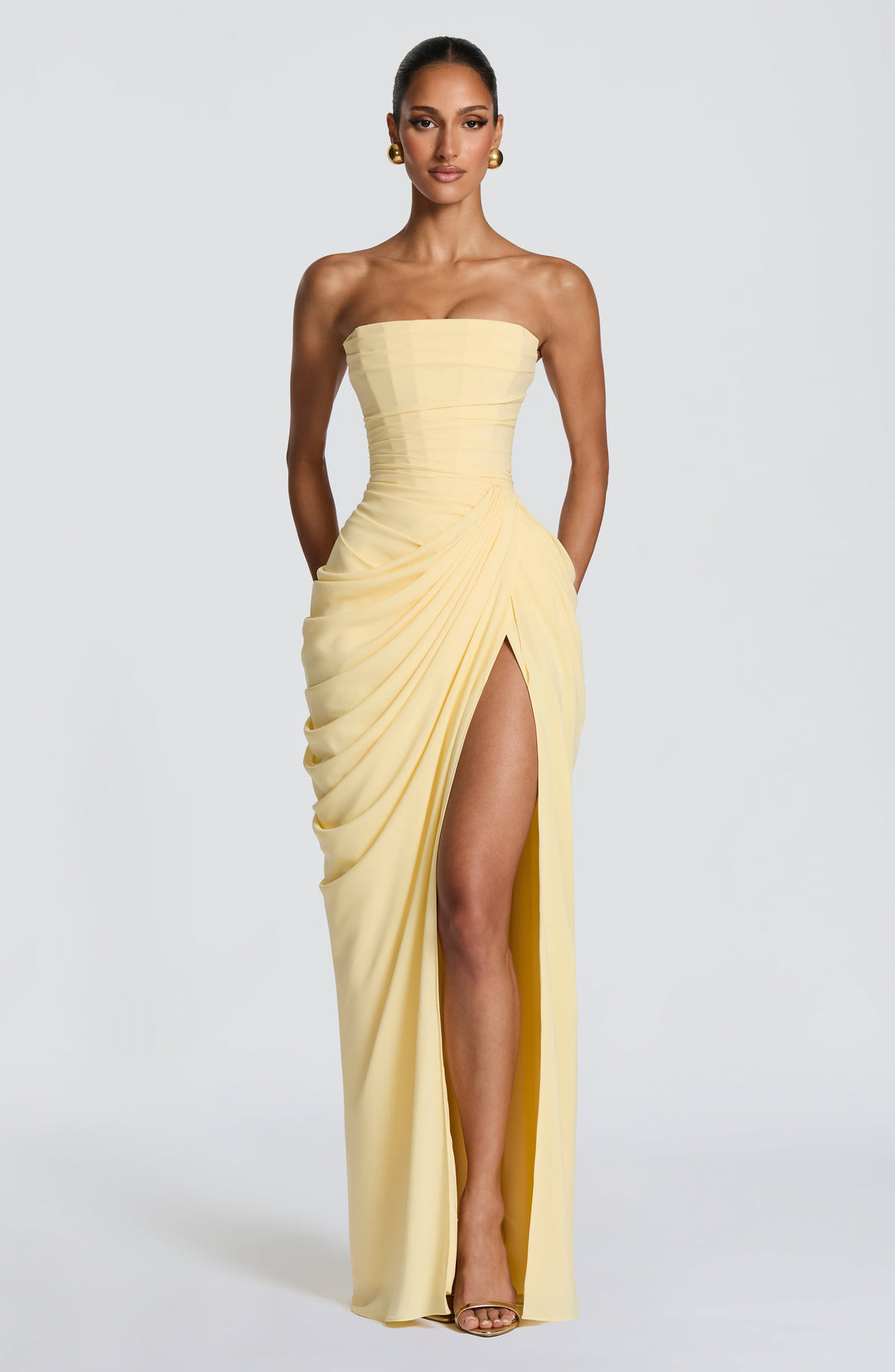 Elegant women's strapless maxi dress with a sophisticated corset bodice and sleek column skirt, perfect for formal events.