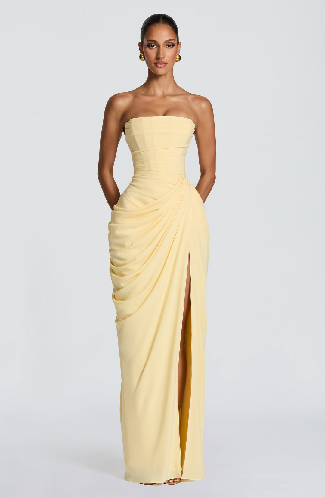 Formal women's strapless maxi gown featuring an intricate corset bodice and a sophisticated column skirt.