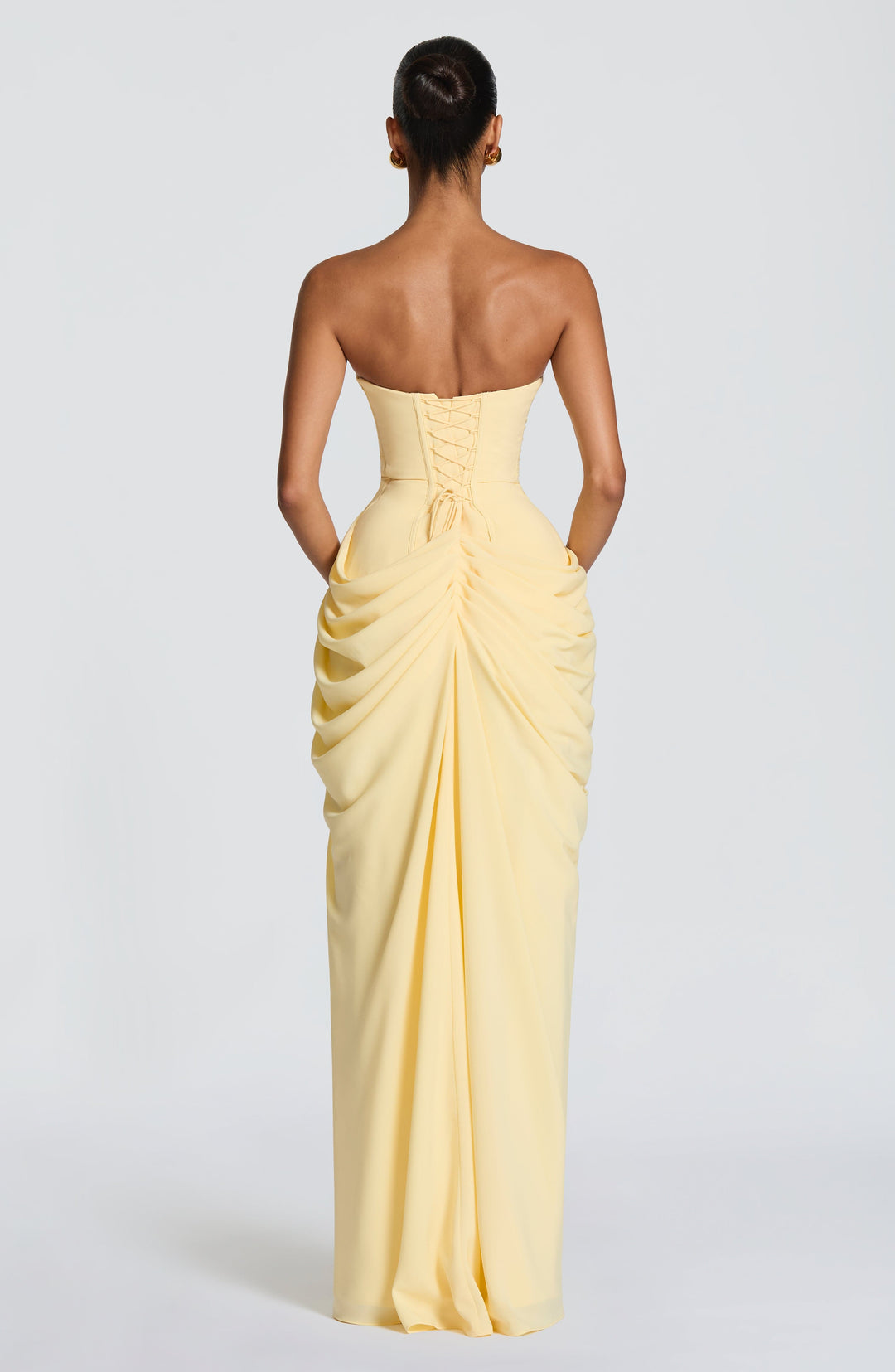 Chic women's strapless formal dress, a maxi design with a figure-hugging corset and a flowing column skirt.