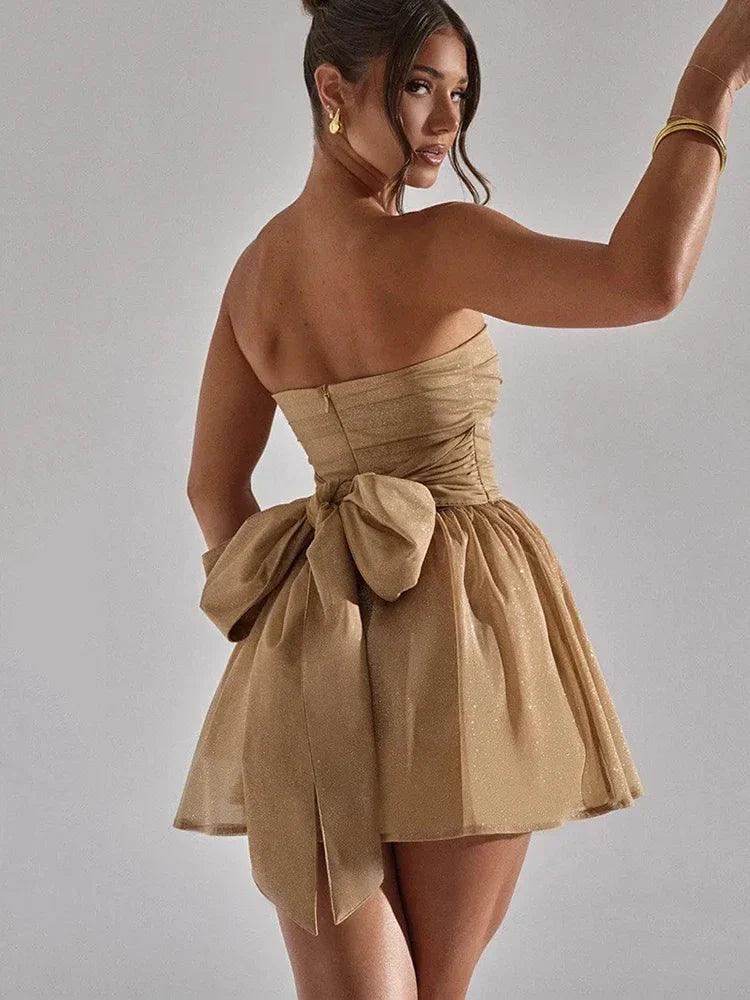 Stylish strapless mini dress for women, featuring a pleated bodice and a flared skirt