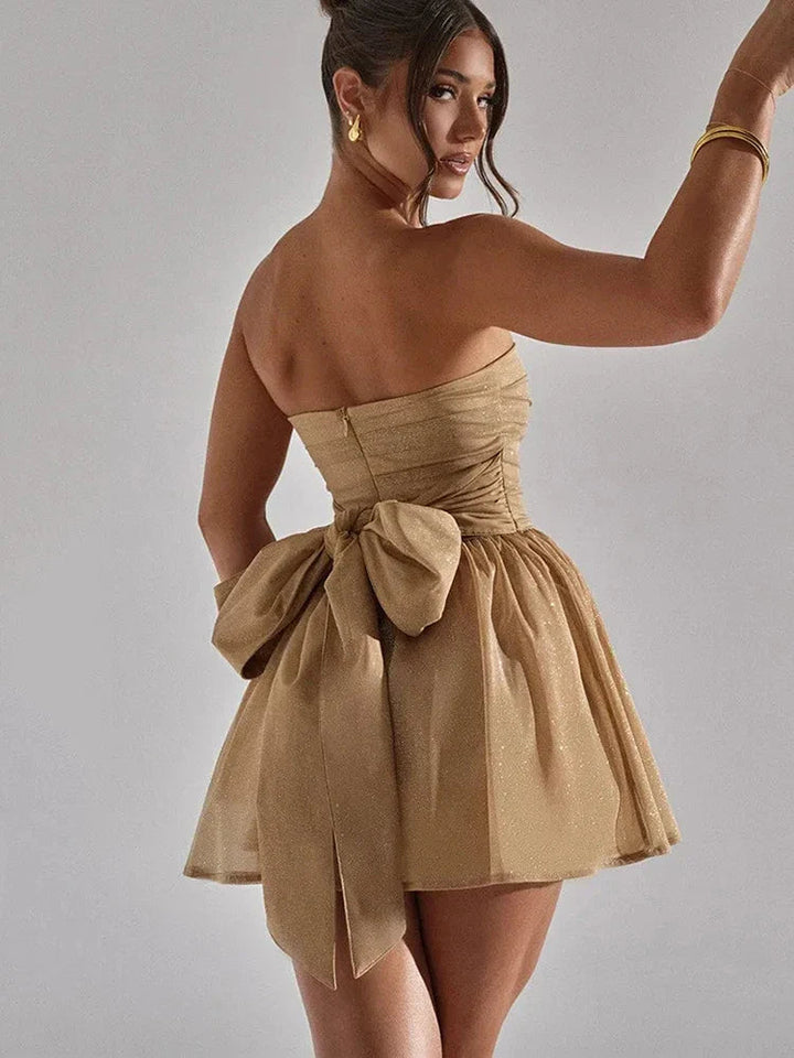 Stylish strapless mini dress for women, featuring a pleated bodice and a flared skirt