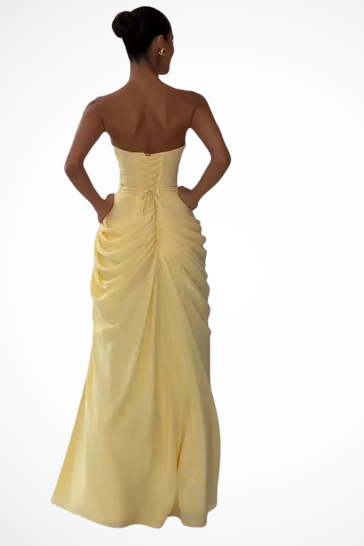 Women's formal strapless maxi dress, featuring elegant ruching & a sexy slit, ideal for evening wear & special events.