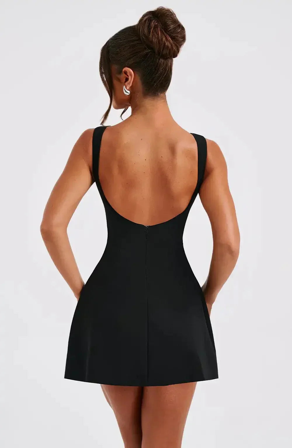 Sleeveless fit & flare mini dress with boat neck, ideal for a party or elegant evening wear.