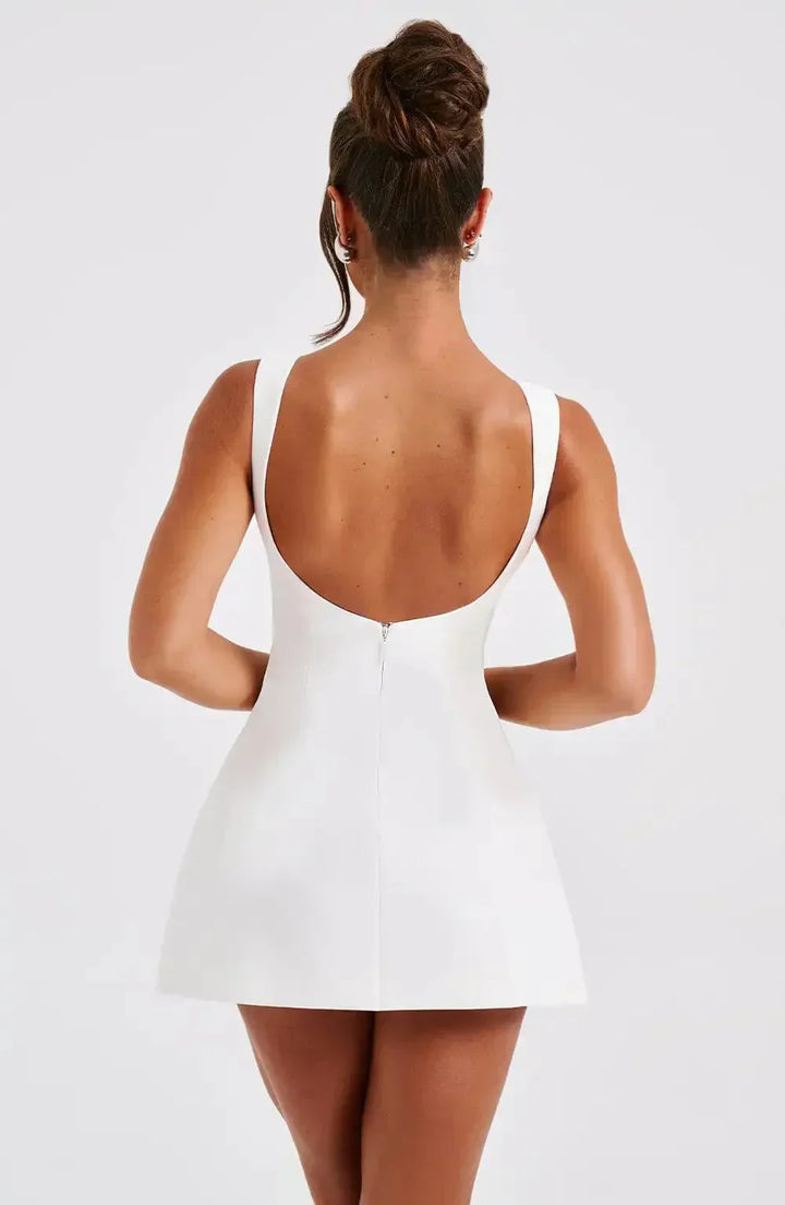 Stylish women's summer mini dress, boat neck & fit & flare cut. A versatile party or evening dress.