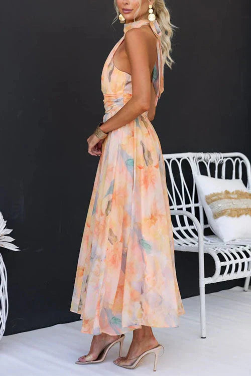 Beautiful women's summer halter maxi dress featuring a chic floral pattern and flowy design