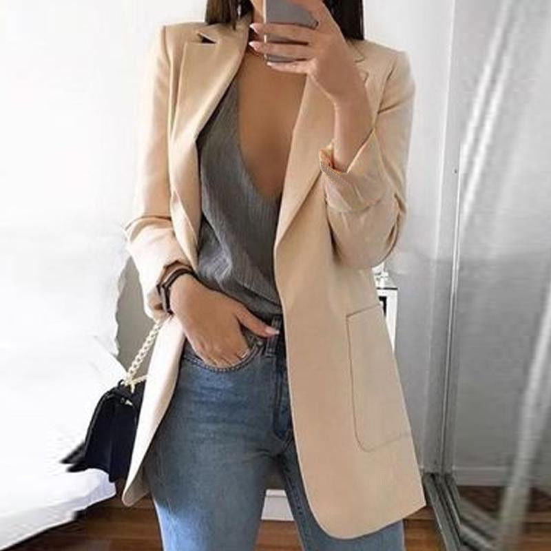 Women's professional tailored blazer, an elegant long sleeve jacket for chic office wear and business attire.