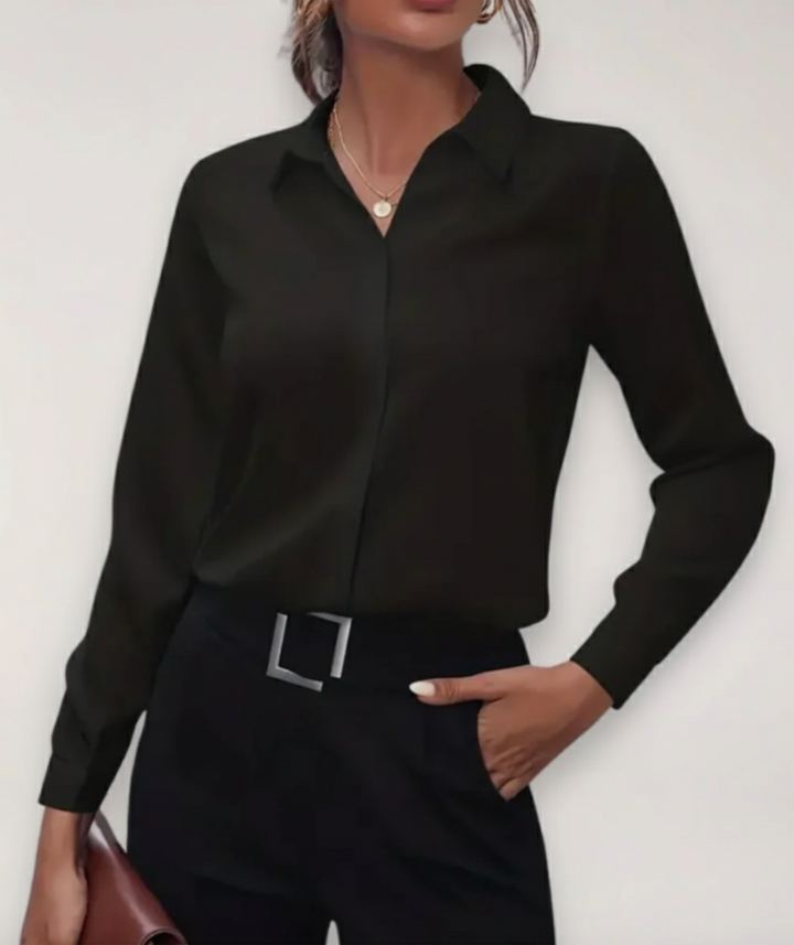 Stylish women's tailored blouse with button-up front, versatile for office and elegant day wear.