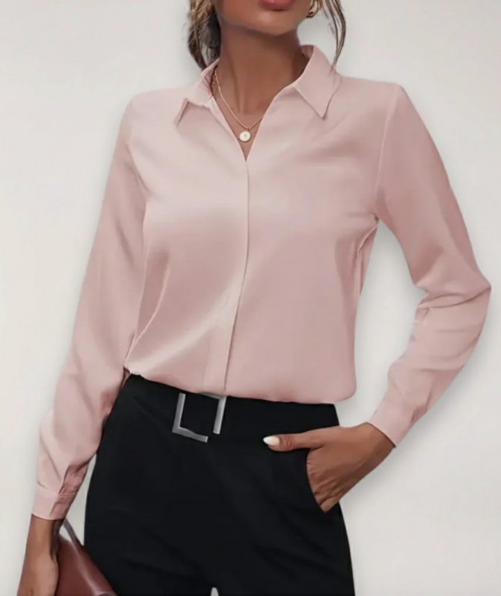 Professional women's elegant button-up blouse, tailored for comfortable work and stylish daywear.