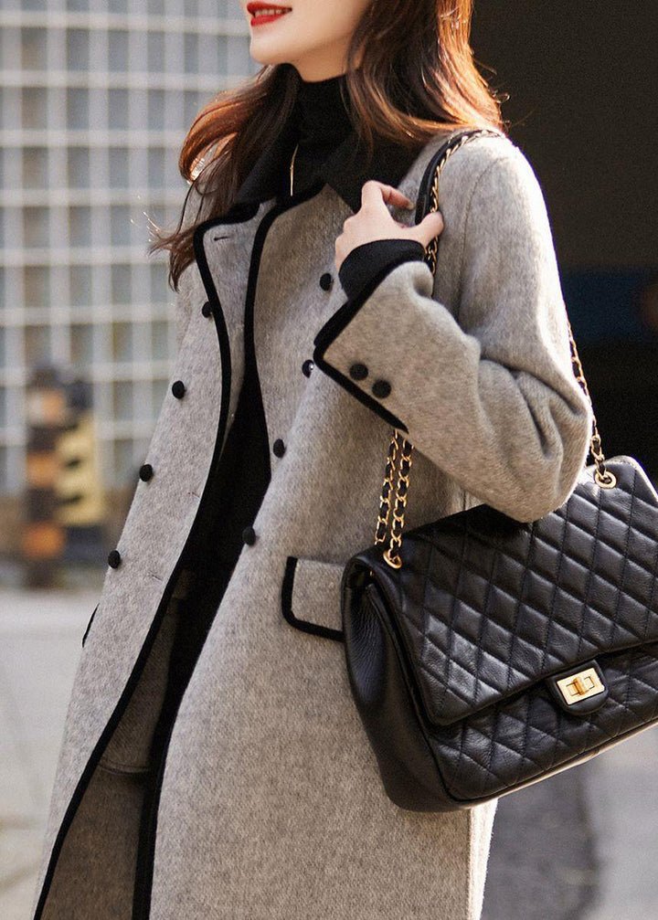 Women's classic tailored coat with structured design. Elegant outerwear creating a sophisticated silhouette for fashion.
