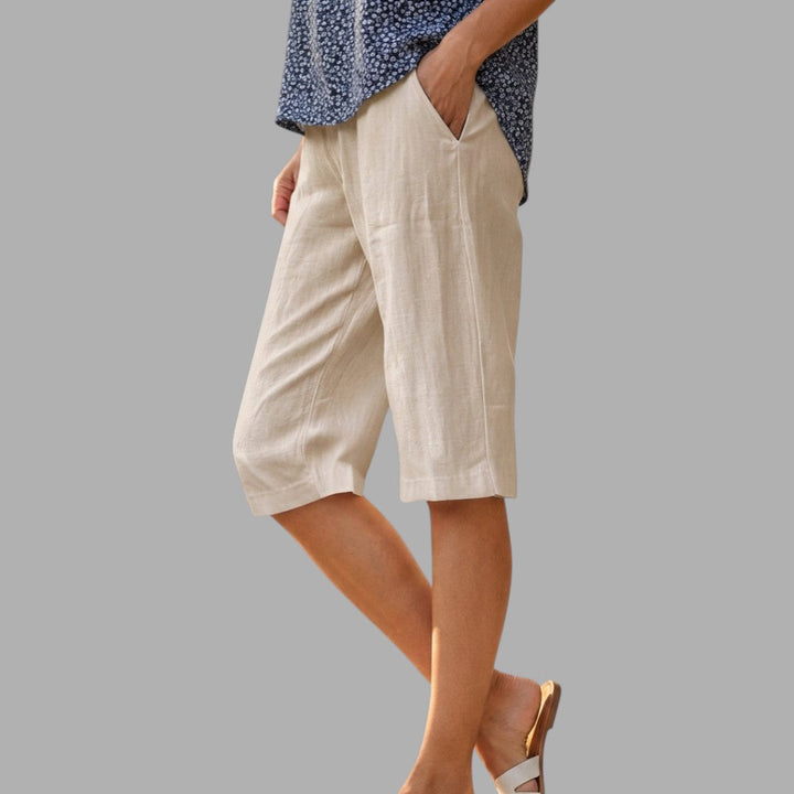 Comfortable classic women's knee-length tailored shorts, ideal for a smart casual summer outfit.