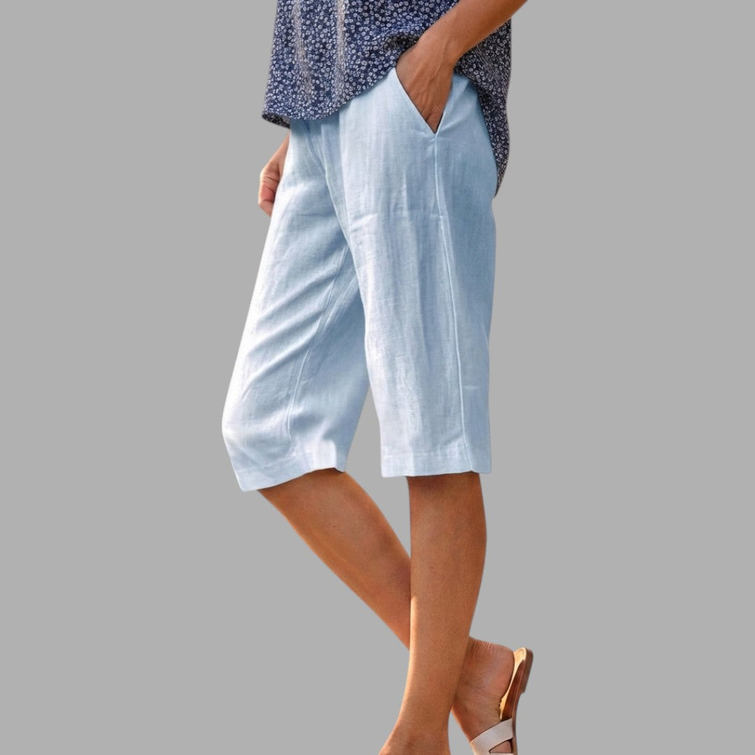 Sophisticated women's tailored knee-length shorts for an elegant summer look. Smart casual fashion.