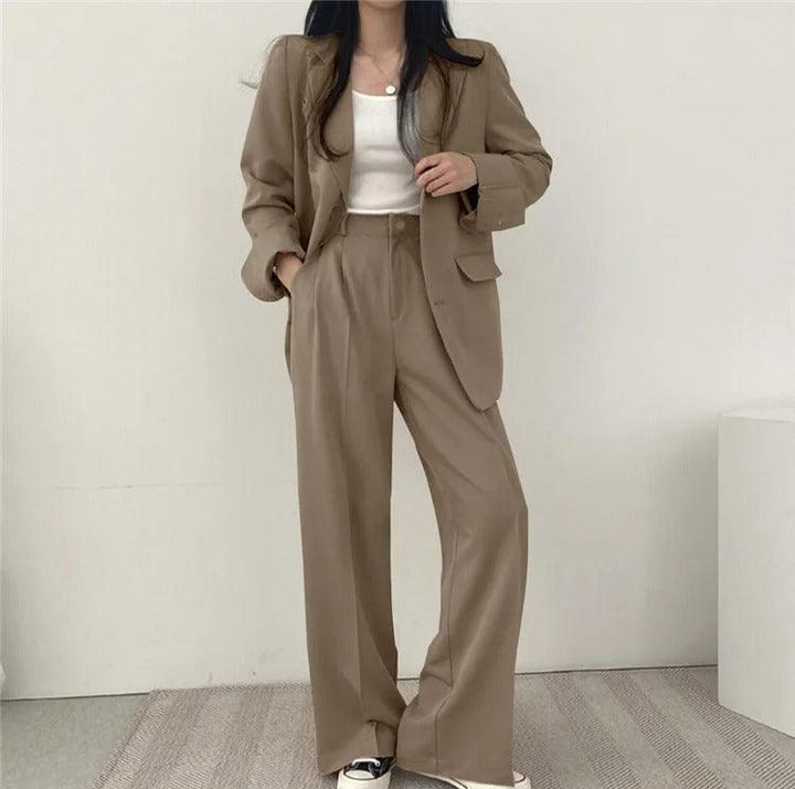 Classic women's suit: long tailored blazer silhouette with complementing trousers