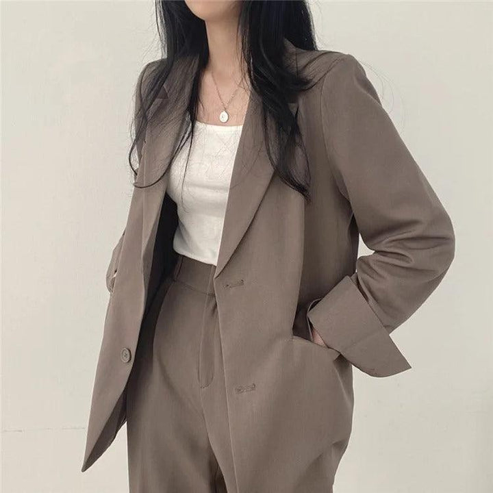 Sophisticated matching set: women's long tailored blazer and formal trousers ensemble
