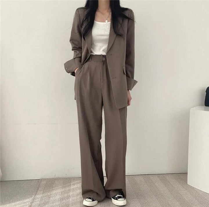 Women's elegant suit ensemble, a long tailored blazer and comfortable, stylish trousers