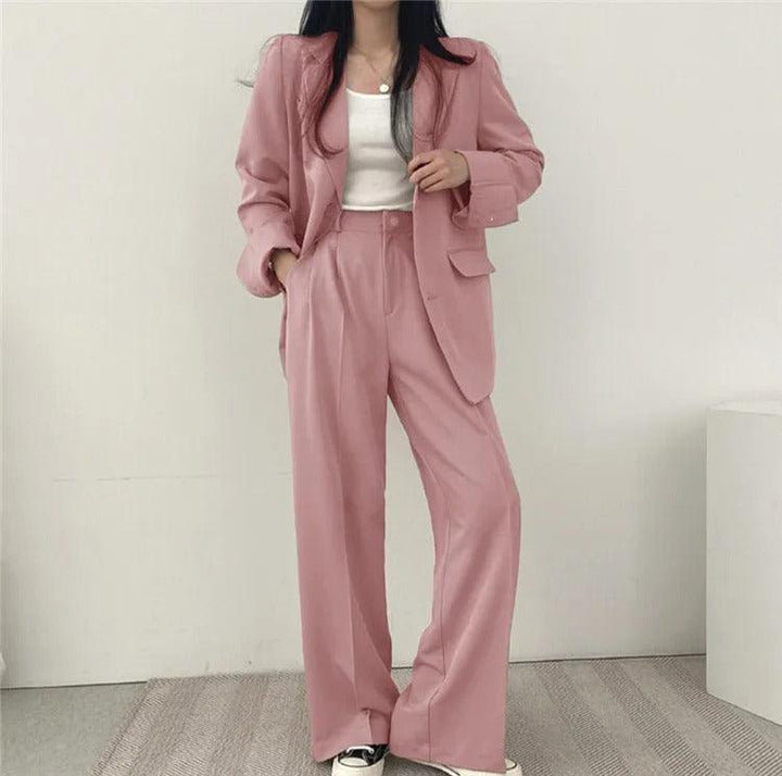 Formal attire women's suit featuring a stylish long tailored blazer and trousers
