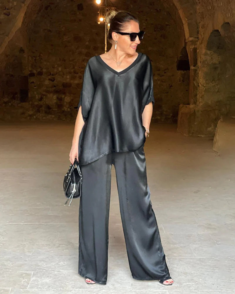 Modern women's two-piece fashion set with a smart top & comfortable pants, perfect for spring office wear.