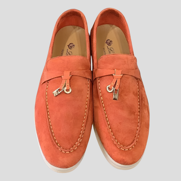 Stylish women's black tassel loafers, sleek slip-on flats suitable for office, casual, or dress.