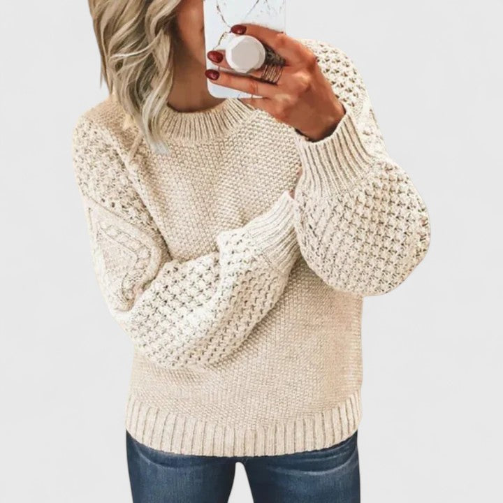 Fashionable women's textured puff sleeve sweater, an elegant statement top for winter and fall style.