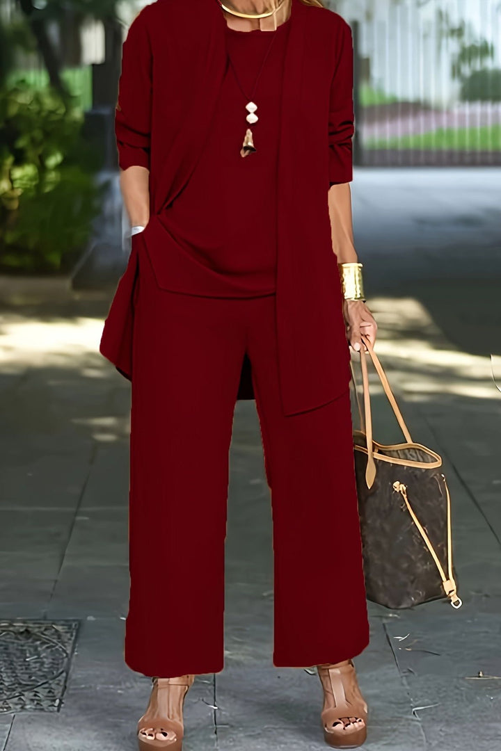 Versatile women's three-piece workwear set; elegant coordinated outfit with wide-leg pants & lightweight jacket.
