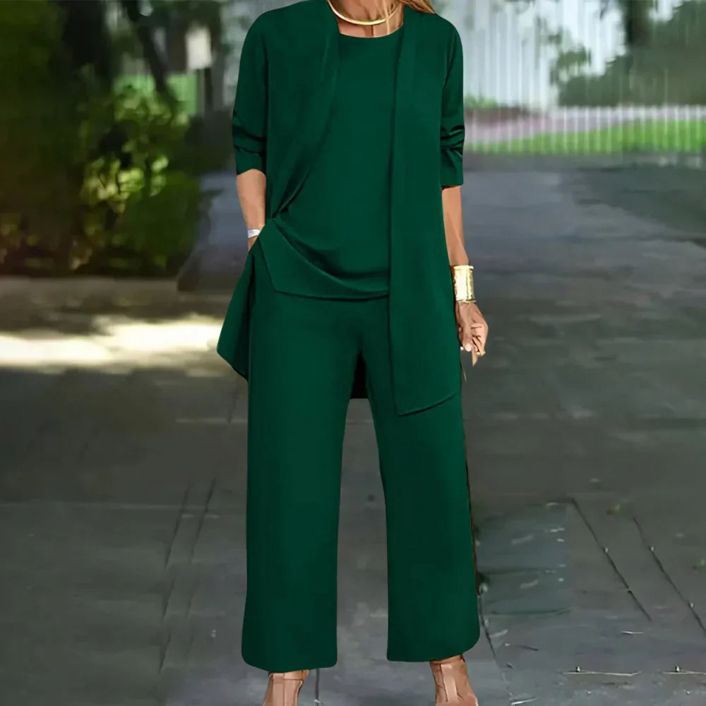 Elegant women's three-piece pantsuit with tailored blazer, vest, and trousers, perfect for business or formal events.